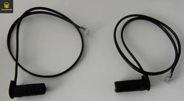 Industrietor mit Schließkantensicherung, Sicherheitskontaktleiste, Optosensor, Lichtschranke und Spiralkabel zur Fehlerbehebung bei Totmannbetrieb und Sicherheitsfehler an der Torsteuerung.
